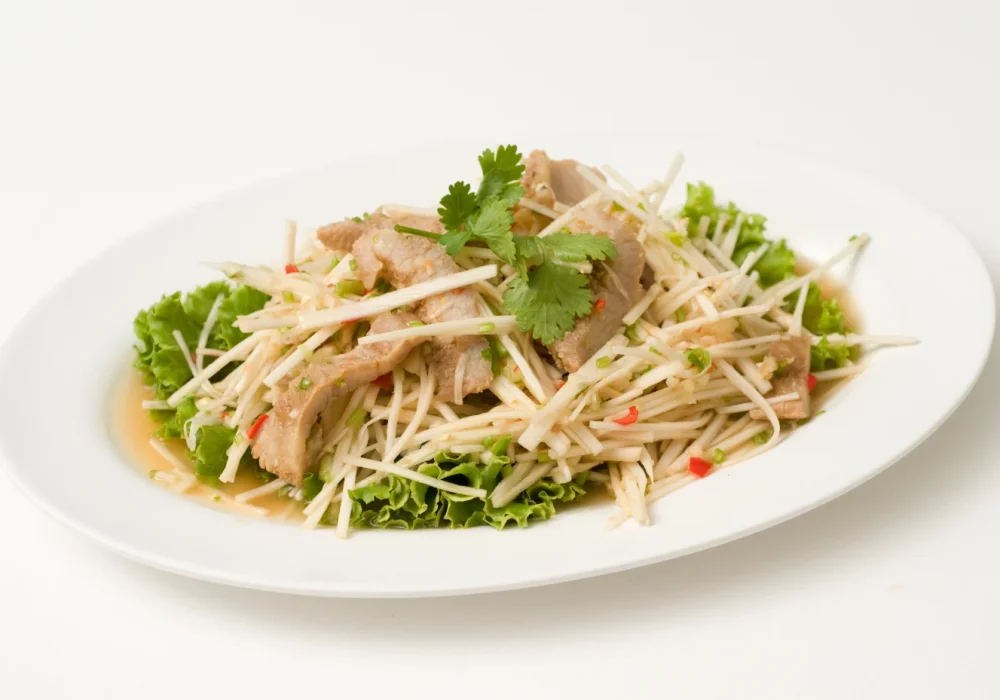 ยำคอหมูย่างยอดมะพร้าว-SPICY-COCONUT-SHOOT-SALAD-WITH-PORK-SHOULDER.webp